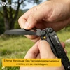 HX Outdoors Multitool mit Verriegelung für externe Werkzeuge und schwarzer Wellenschliff-Klinge in Händen im Freien