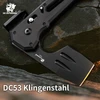 Schwarzes HX Outdoors Beil aus DC53 Klingenstahl auf Stein mit Logo-Aufdruck
