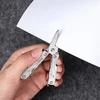 NexTool Mini-Multitool Schere schneidet weißes Papier im Praxistest