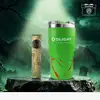 Olight Taschenlampe Arkfeld Pro Zombie Edition und grüner Thermobecher auf einem Stein vor düsterem Hintergrund