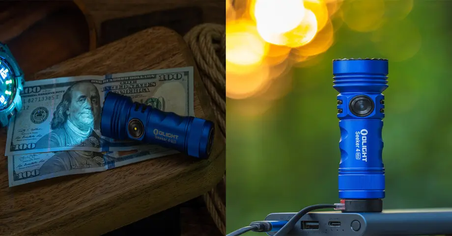 Blaue Olight Taschenlampe auf Holz mit Geldscheinen und im Freien aufgeladen, im Hintergrund unscharfes Bokeh.